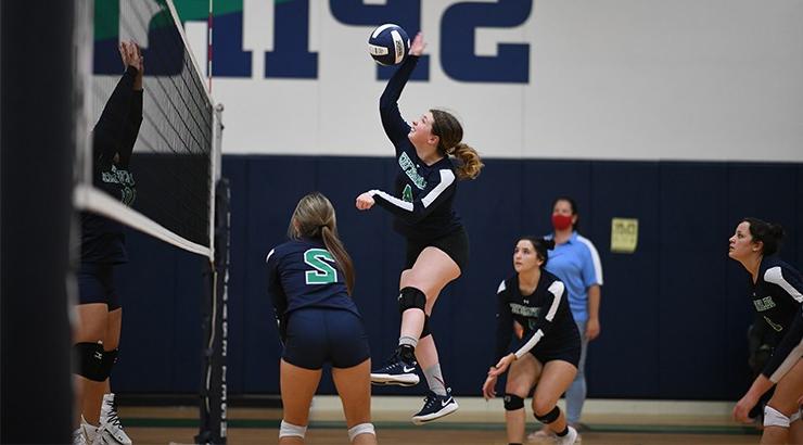 A volleyball player spiking the ball